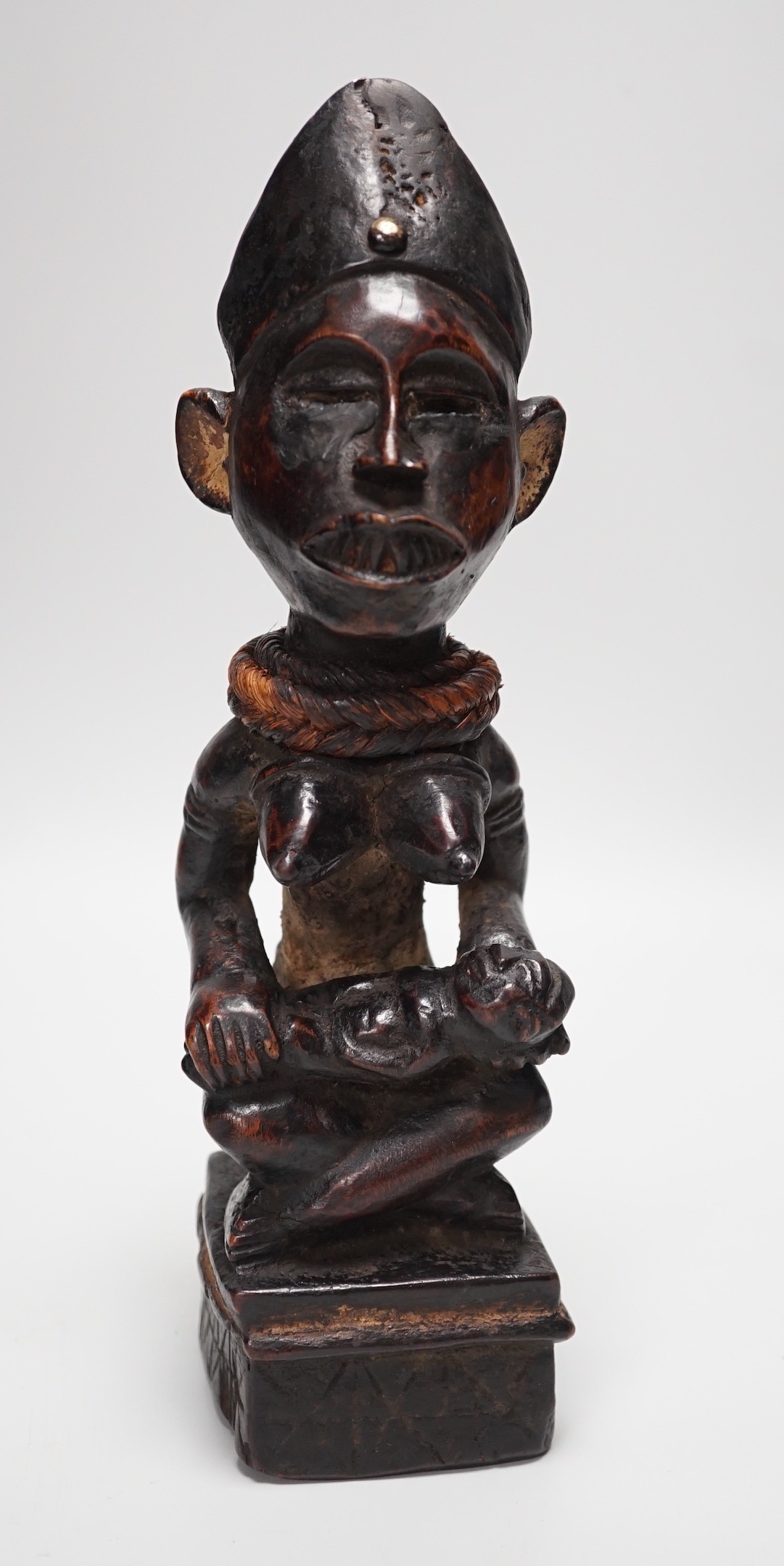 An African tribal wooden maternity figure, Yombe tribe Congo 30cm